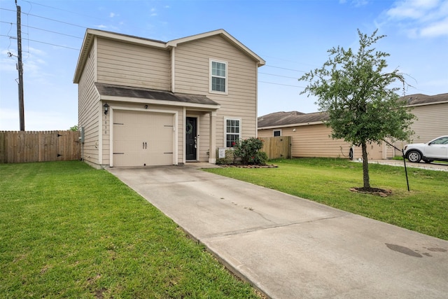 traditional-style house with an attached garage, fence, a front yard, and concrete driveway