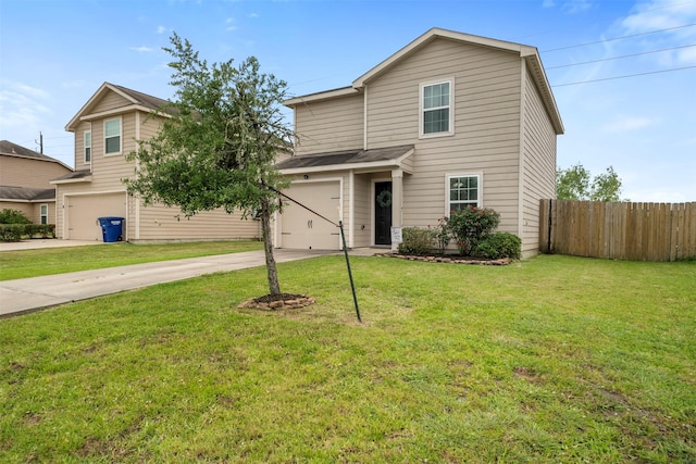traditional home with fence, an attached garage, driveway, and a front yard