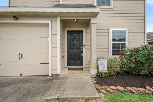 property entrance with a garage