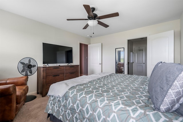 bedroom featuring light colored carpet, baseboards, and ceiling fan