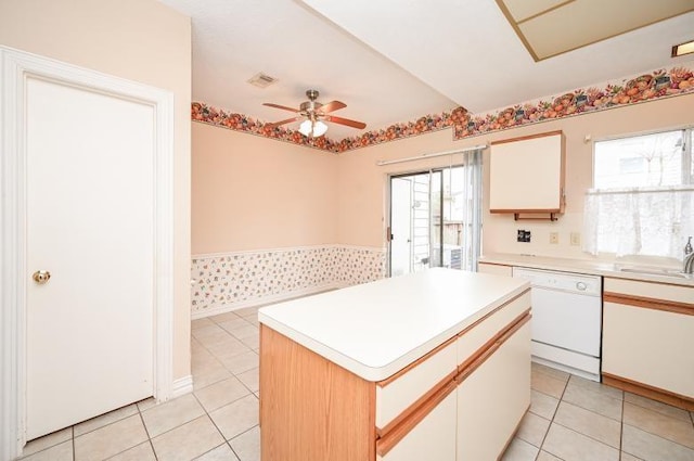 kitchen featuring dishwasher, visible vents, a ceiling fan, and white cabinetry