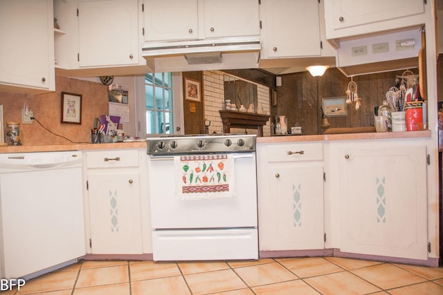 kitchen featuring light tile patterned floors, decorative backsplash, under cabinet range hood, and white appliances