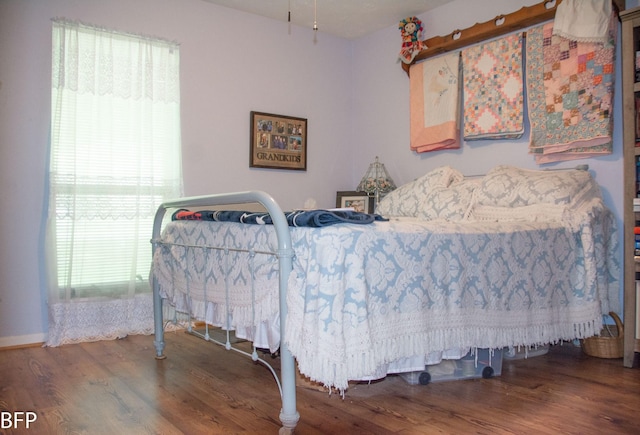 bedroom featuring wood finished floors
