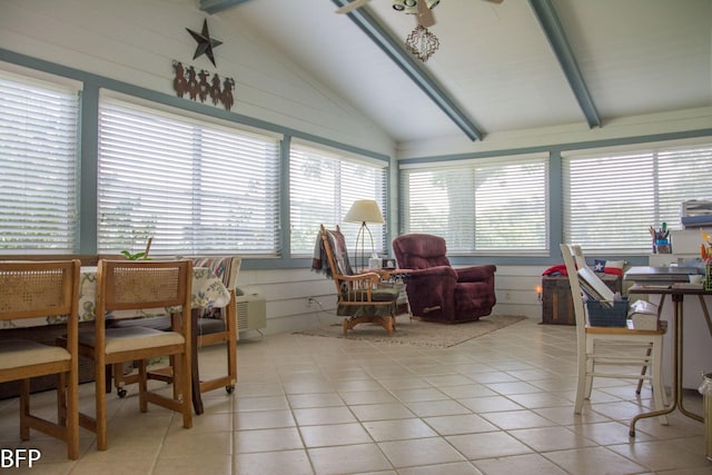 sunroom featuring lofted ceiling with beams and tile patterned flooring