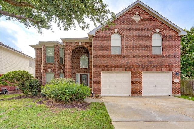 traditional-style home featuring concrete driveway, brick siding, and an attached garage