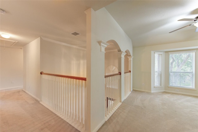 hall featuring baseboards, carpet flooring, attic access, and visible vents