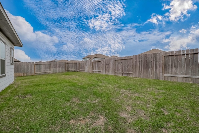 view of yard featuring a fenced backyard