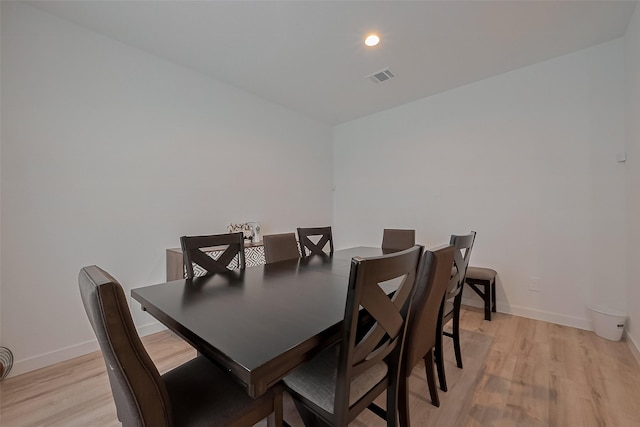 dining room with recessed lighting, light wood-style flooring, visible vents, and baseboards