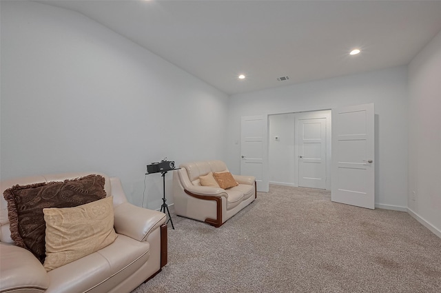 sitting room with baseboards, carpet flooring, visible vents, and recessed lighting