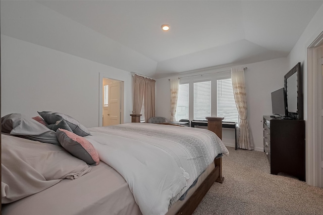 bedroom with recessed lighting, a raised ceiling, connected bathroom, baseboards, and light colored carpet