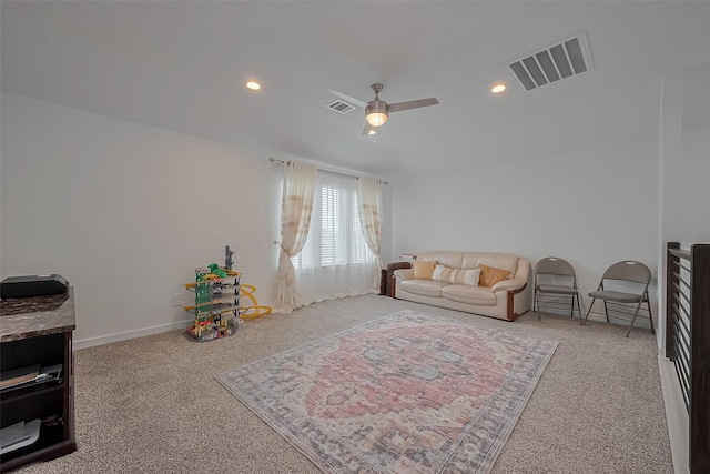 living room with recessed lighting, visible vents, and carpet