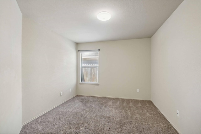 7218 Alava Dr, Magnolia, TX 77354 - spare room featuring carpet flooring and baseboards