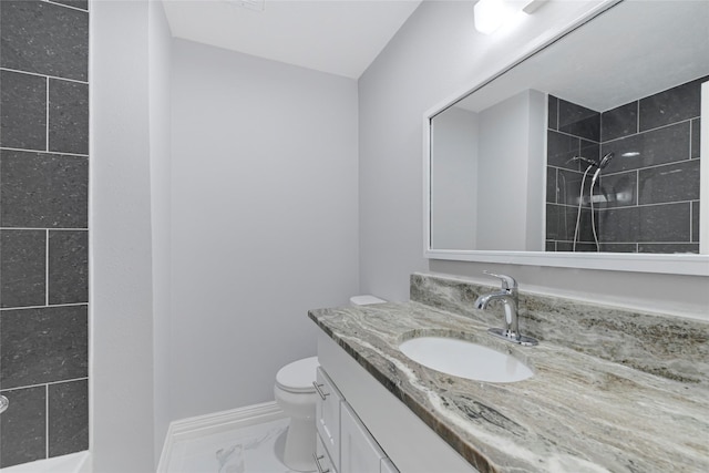 6326 Cambridge Glen Ln, Houston, TX 77035 - full bathroom with vanity, marble finish floor, toilet, baseboards, and a tile shower