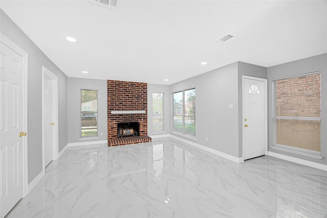 unfurnished living room with baseboards, visible vents, and marble finish floor