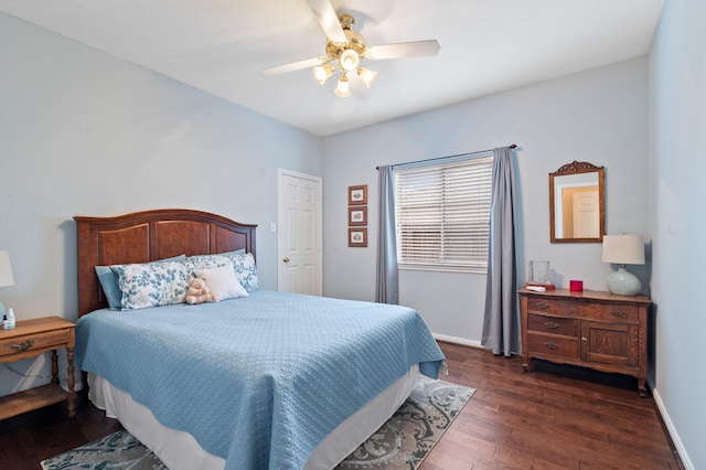 bedroom featuring ceiling fan, dark wood finished floors, and baseboards