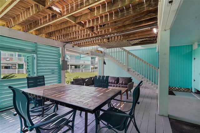 604 Calico Jack Cv, Galveston, TX 77554 - wooden deck featuring outdoor dining space
