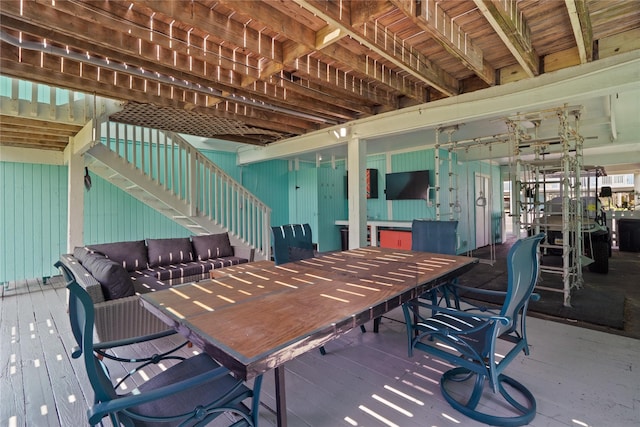 604 Calico Jack Cv, Galveston, TX 77554 - view of patio featuring outdoor dining area and stairs
