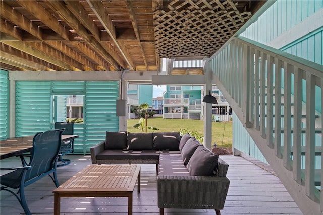 604 Calico Jack Cv, Galveston, TX 77554 - wooden terrace featuring outdoor dining space, a yard, and an outdoor hangout area