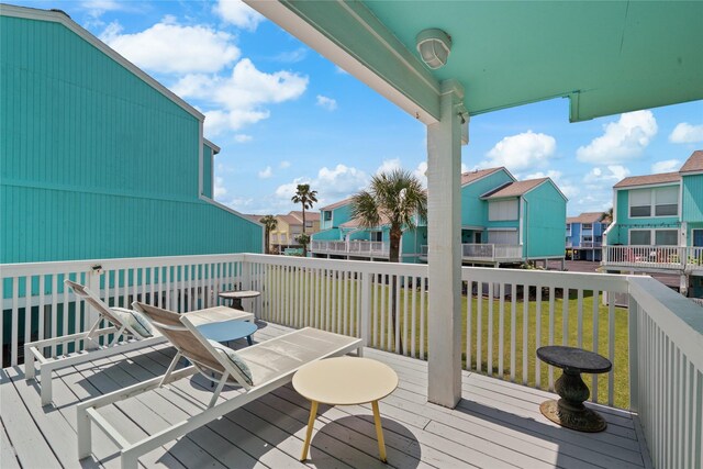 604 Calico Jack Cv, Galveston, TX 77554 - deck featuring a residential view and a lawn