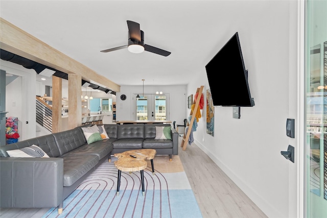 604 Calico Jack Cv, Galveston, TX 77554 - living area featuring light wood-style flooring, a ceiling fan, and baseboards