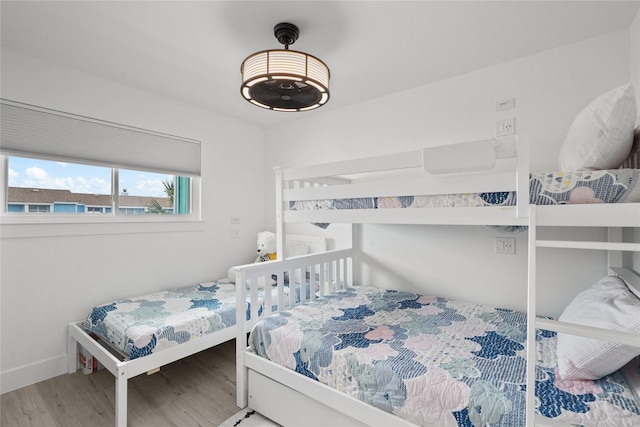 604 Calico Jack Cv, Galveston, TX 77554 - bedroom with wood finished floors and baseboards