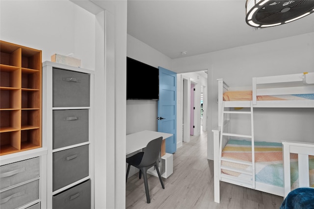 604 Calico Jack Cv, Galveston, TX 77554 - bedroom with baseboards and light wood finished floors