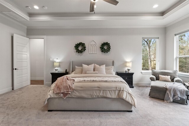 1406 Amber Cv, Willis, TX 77378 - carpeted bedroom featuring a raised ceiling, crown molding, baseboards, and a ceiling fan