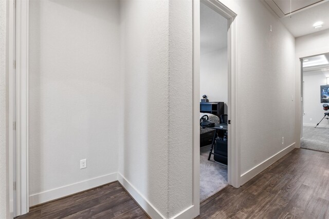 1406 Amber Cv, Willis, TX 77378 - hall with attic access, dark wood finished floors, and baseboards