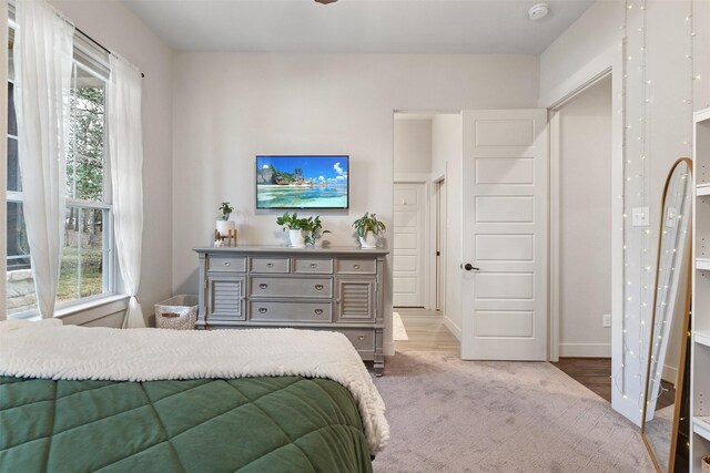 1406 Amber Cv, Willis, TX 77378 - carpeted bedroom with baseboards