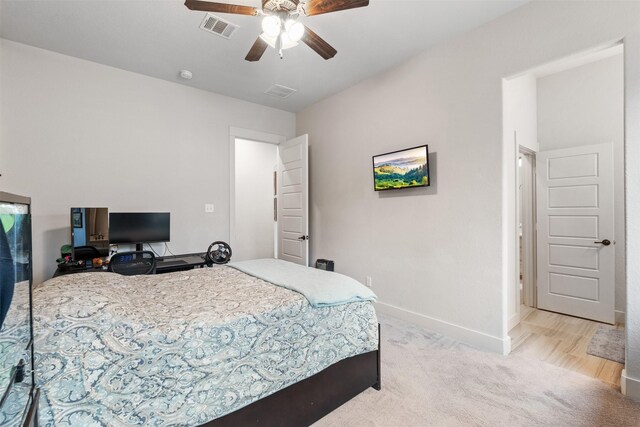 1406 Amber Cv, Willis, TX 77378 - bedroom featuring baseboards, light colored carpet, and a ceiling fan