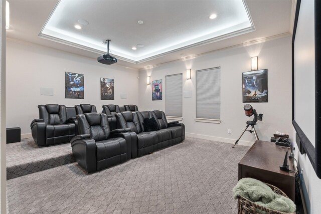 1406 Amber Cv, Willis, TX 77378 - home theater room featuring a raised ceiling, carpet, recessed lighting, crown molding, and baseboards