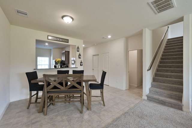 dining room with stairway, recessed lighting, visible vents, and light tile patterned floors