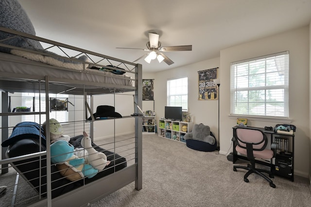 bedroom featuring baseboards, a ceiling fan, and carpet
