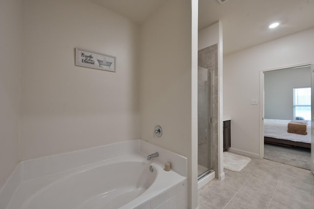 ensuite bathroom featuring a bath, ensuite bathroom, recessed lighting, and a shower stall