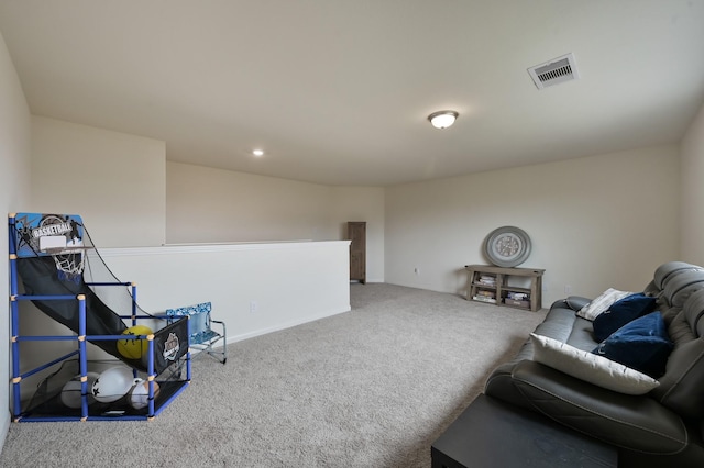 interior space featuring visible vents, carpet flooring, baseboards, and an upstairs landing