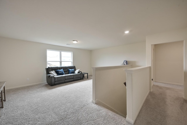 interior space with baseboards, carpet floors, and recessed lighting