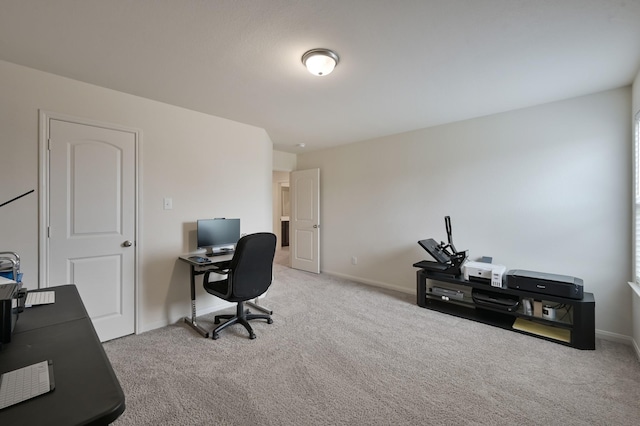 office space with baseboards and carpet flooring