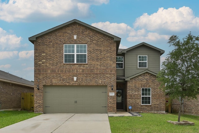 view of front of house with driveway, an attached garage, fence, a front yard, and brick siding