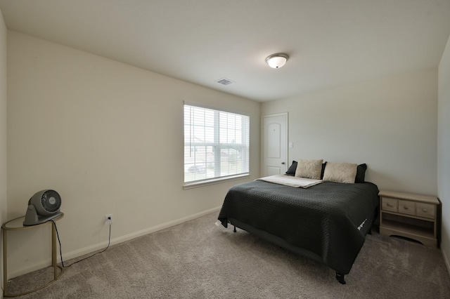 bedroom with visible vents, baseboards, and carpet flooring
