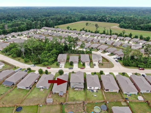 aerial view featuring a view of trees and a residential view