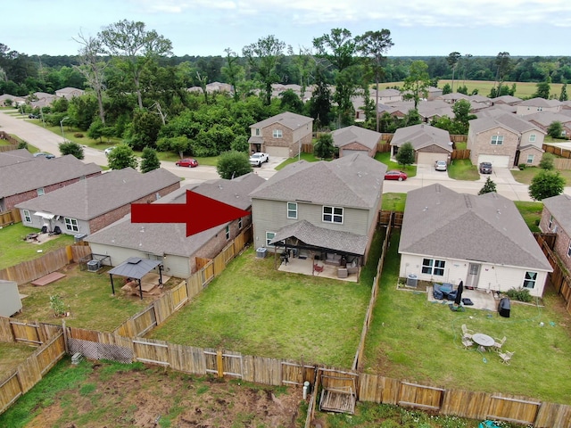 birds eye view of property with a residential view