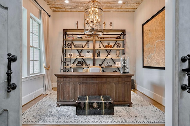 office area featuring plenty of natural light, baseboards, wood finished floors, wooden ceiling, and recessed lighting