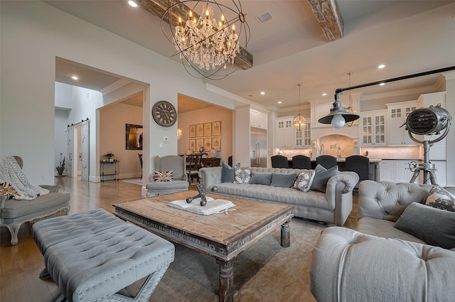 living area featuring light wood-style floors, a chandelier, recessed lighting, crown molding, and beamed ceiling