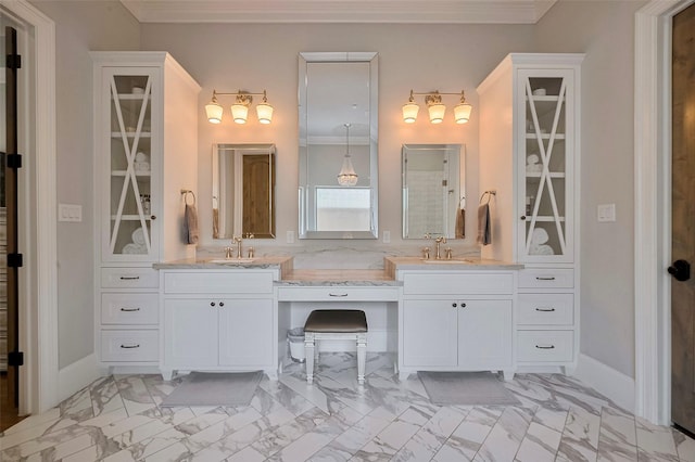 bathroom featuring marble finish flooring, ornamental molding, and double vanity