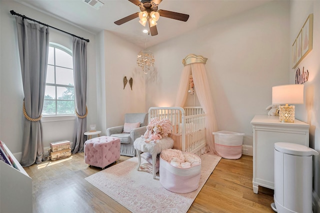 bedroom featuring light wood-style floors and ceiling fan