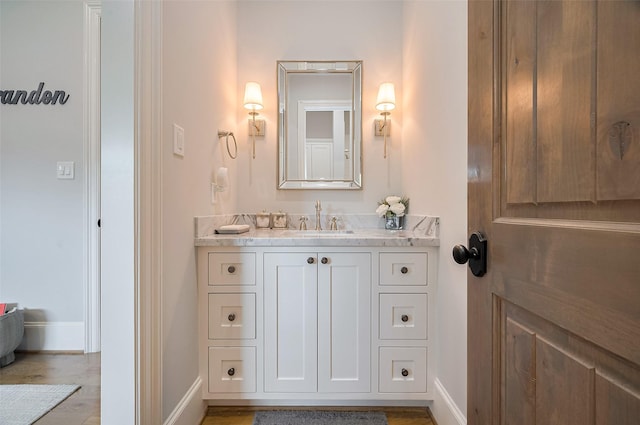 bathroom with baseboards and vanity