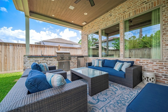 view of patio / terrace featuring outdoor lounge area, area for grilling, and a fenced backyard
