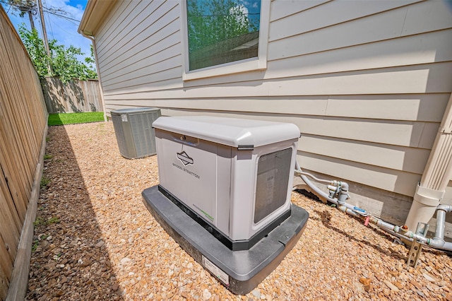 exterior view of a power unit, fence, and central AC