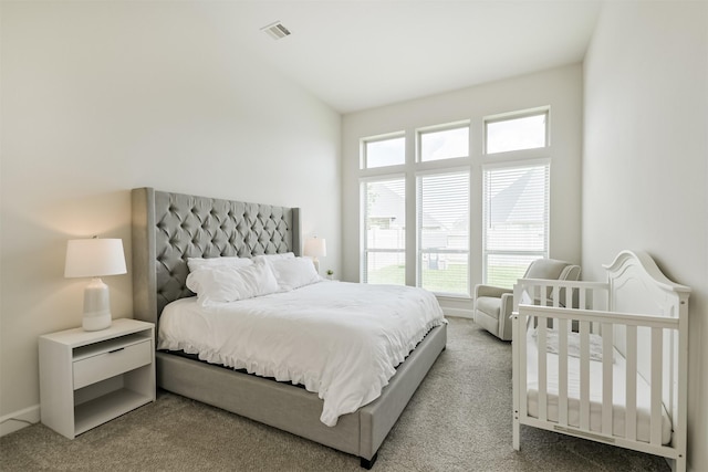carpeted bedroom with baseboards and visible vents