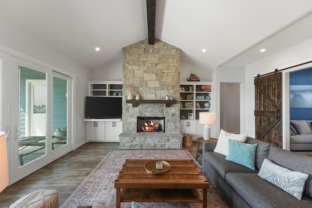 254 Peninsula Dr, Livingston, TX 77351 - living room featuring a barn door, wood finished floors, vaulted ceiling with beams, and recessed lighting